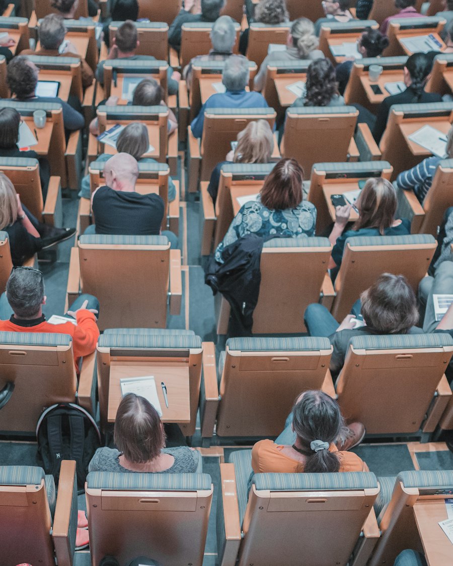 Students seated in a lecture hall, seen from above